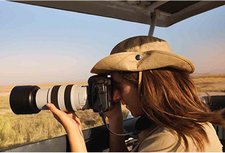 Tourist taking photos on safari